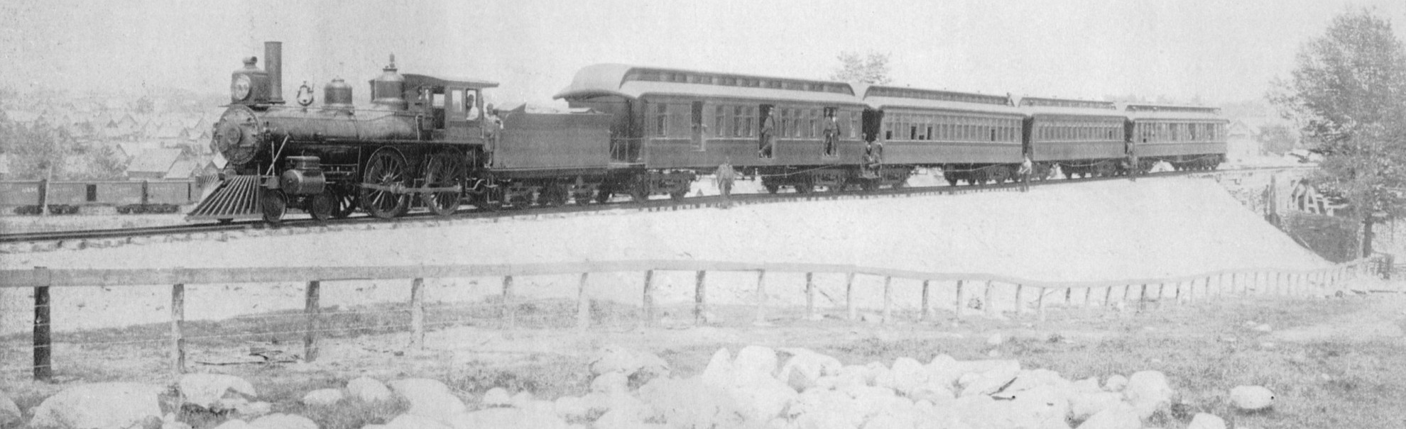 A Canada Atlantic Railway passenger train on a new embankment, headed by a 4-4-0 locomotive
